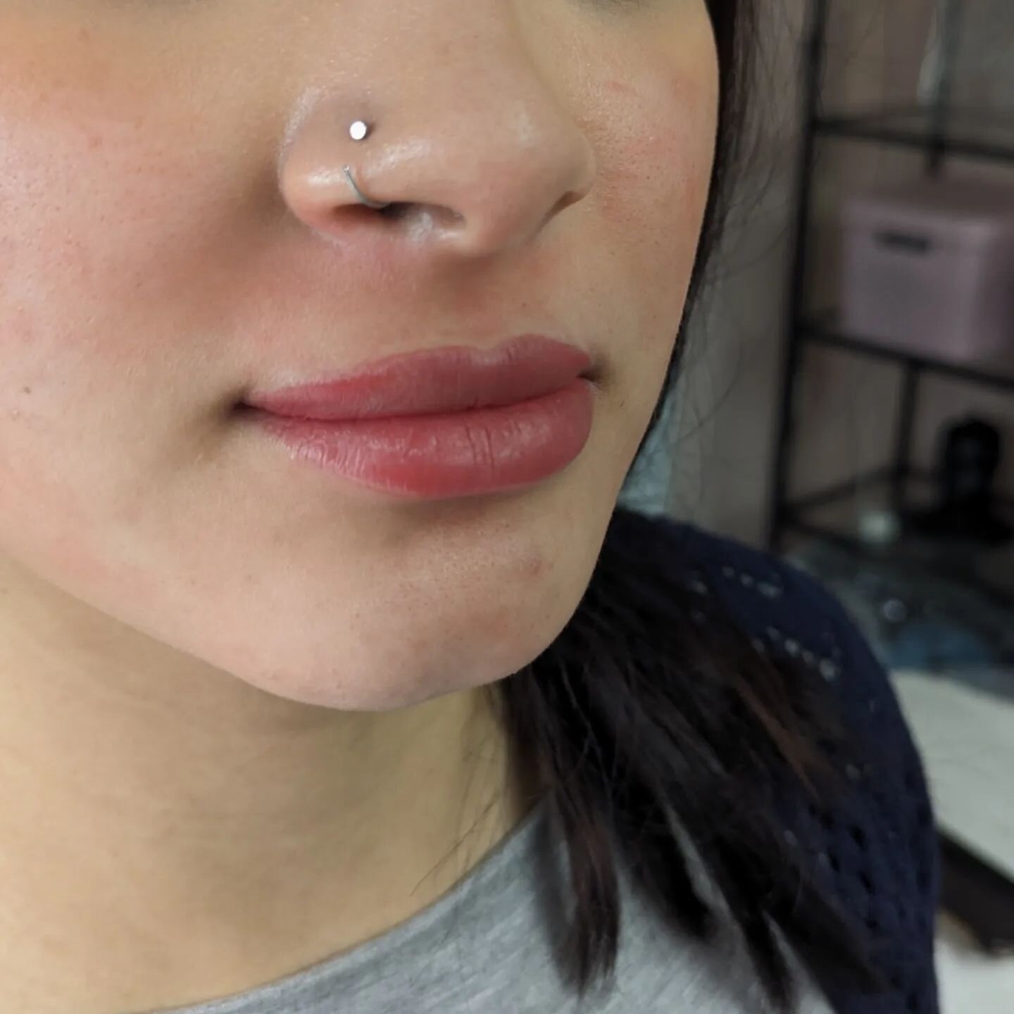 This client of mine wanted a natural lip color! We used soft pinks with a little bit of warmth to even out this light hyperpigmentation in her upper lip! Lip blushing is totally customizable to fit all desired outcomes. Whether it is just a little bi