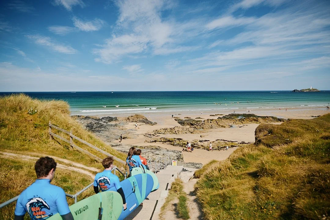 Surf lesson on one of Cornwall's beaches, chosen for the day's conditions