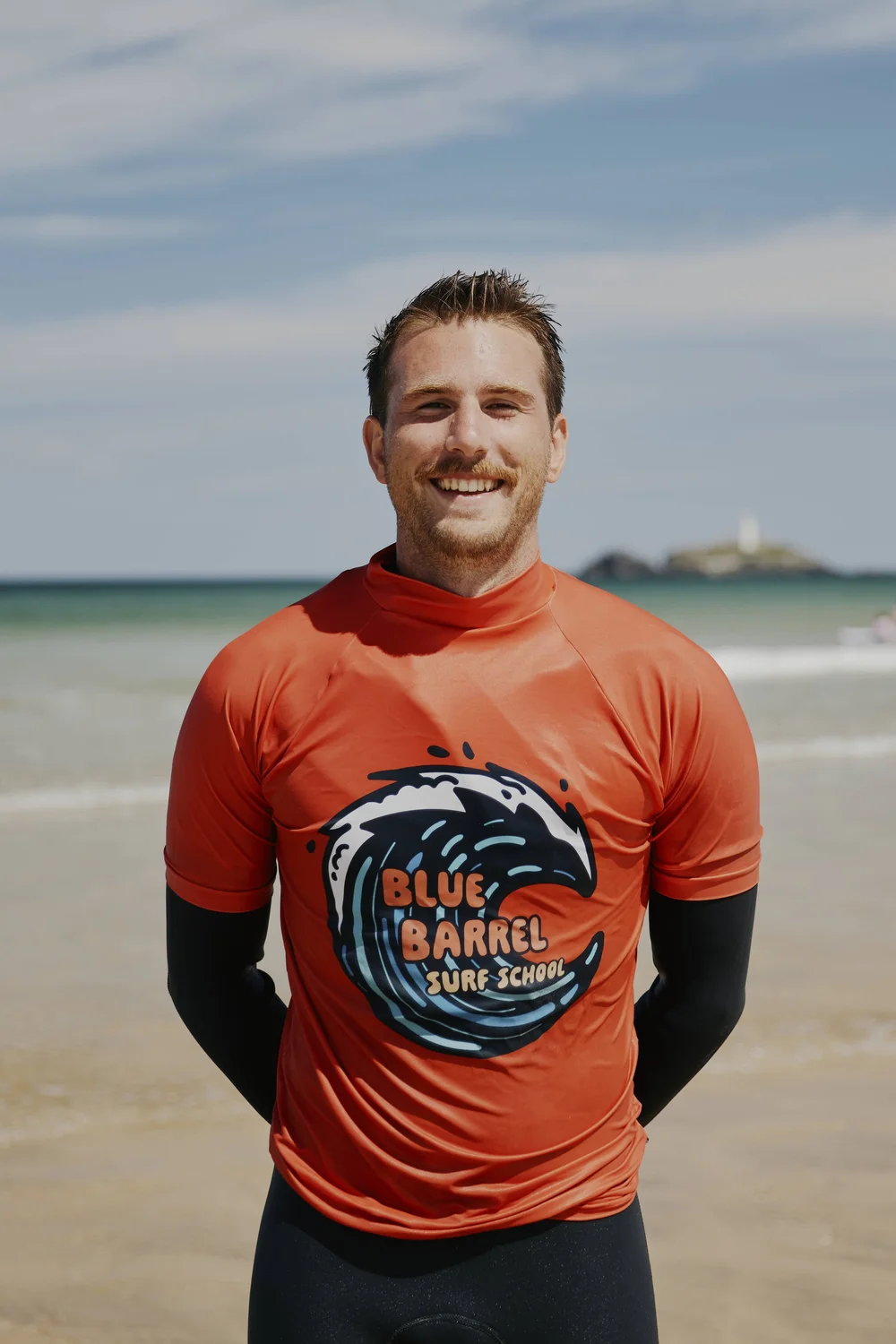 Jack, founder of Blue Barrel Surf School, coaching a private surf lesson in Cornwall