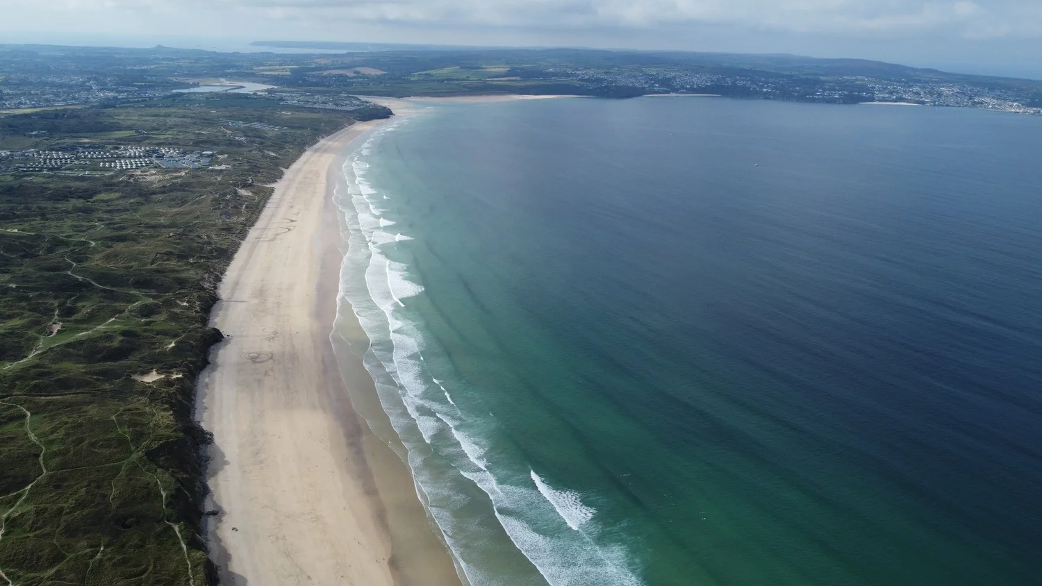 Aerial view of Gwithian beach and St Ives Bay in Cornwall, a private surf lesson location