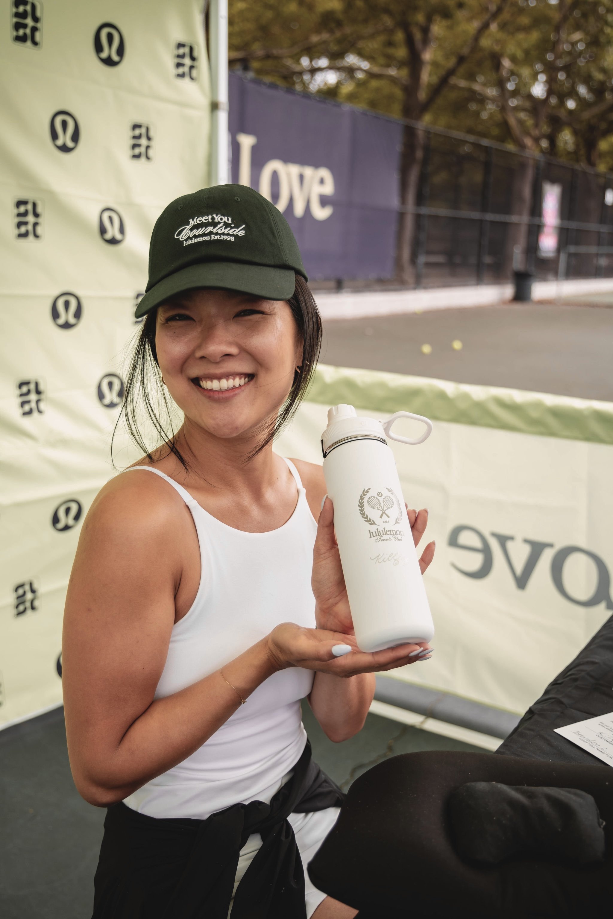 Live event calligrapher at Lululemon event showcasing engraved bottle