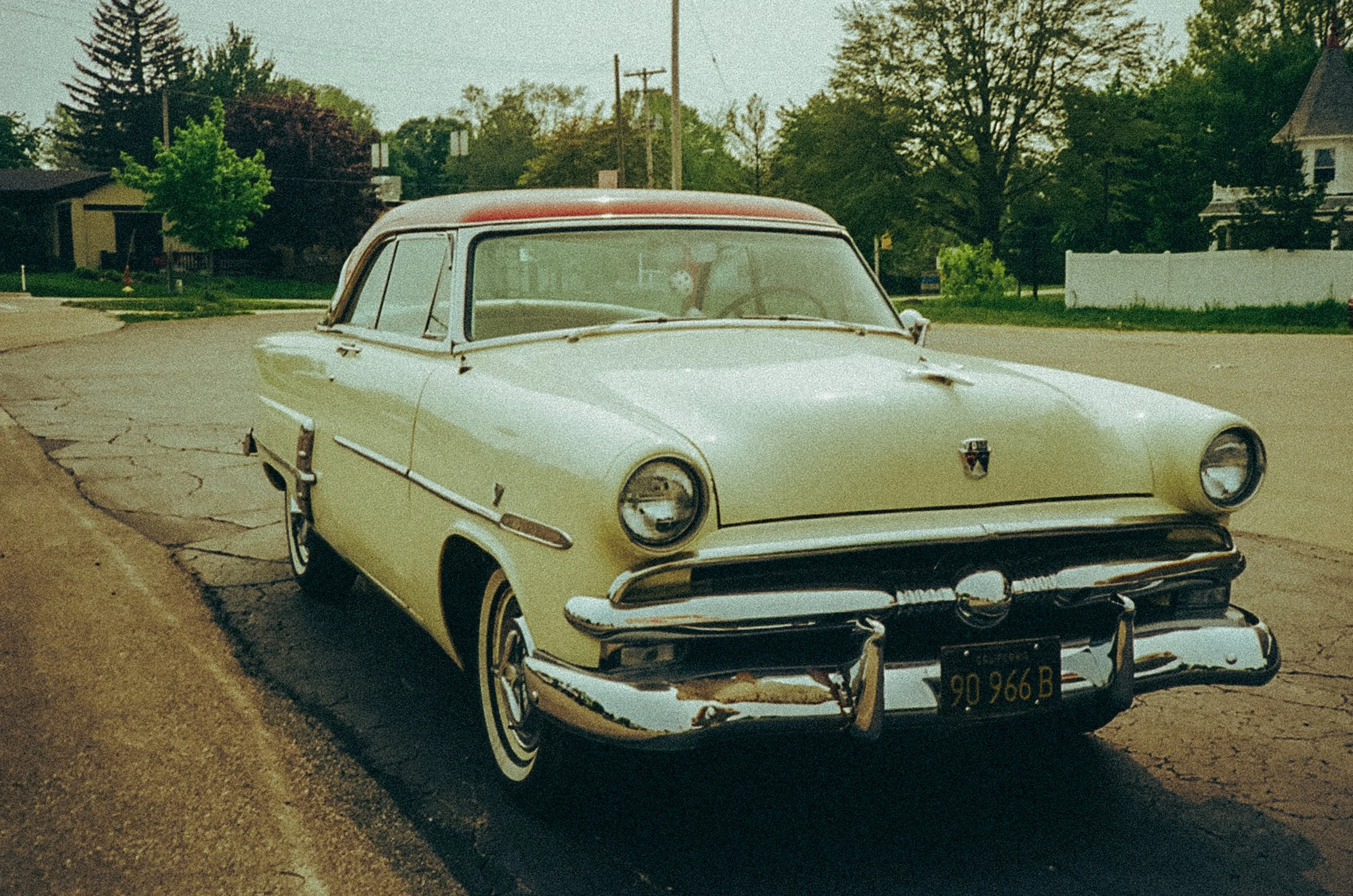 Vintage 1950s car parked on a residential street