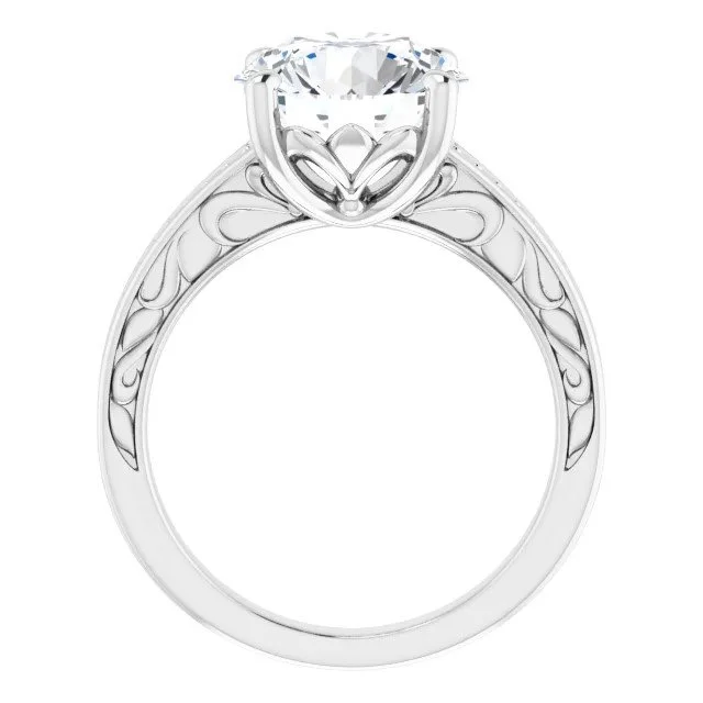 A silver engagement ring with a large diamond solitaire and intricate floral detailing on the band.