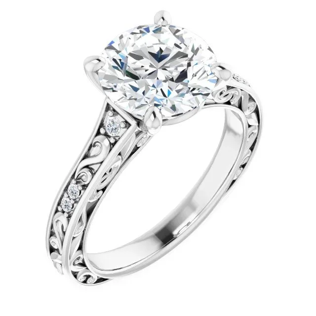 A silver engagement ring with a large round diamond center stone and smaller diamonds along the band, featuring intricate scrollwork design.