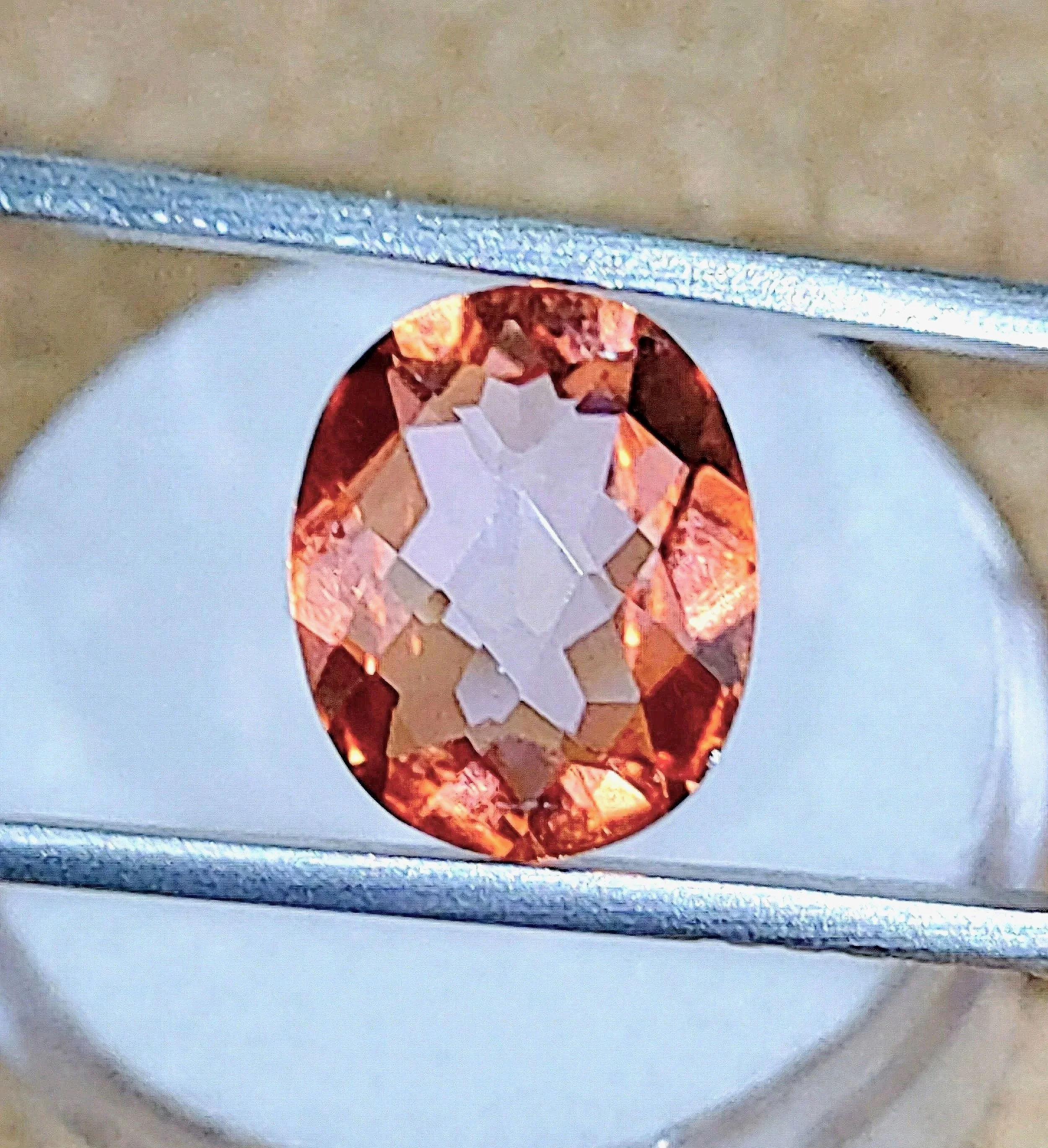 Salmon Treated Topaz 4.86 carats • Oval / Checkerboard