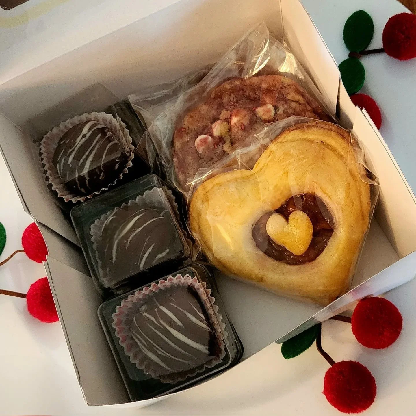 Need a Monday pick-me-up? I still have a few treat boxes left for sale at $10 each, including porch drop-off in the Wichita area (contingent on the distance). Each box contains 3 chocolate-covered cherry cream cordials, 2 raspberry white chocolate co
