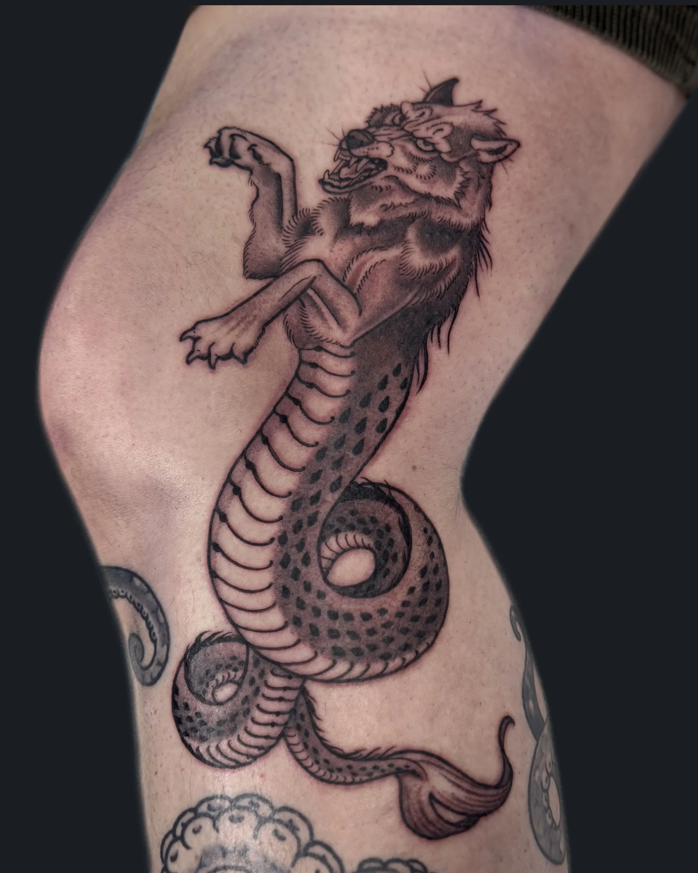 Neotraditional black and grey wolf-leviathan hybrid English Cousins at Pilgrimage Tattoo