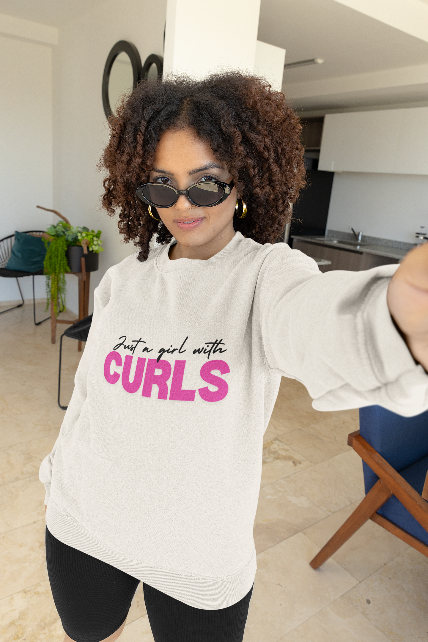 mockup-of-a-curly-haired-woman-taking-a-selfie-in-a-gildan-sweatshirt-m31486.png