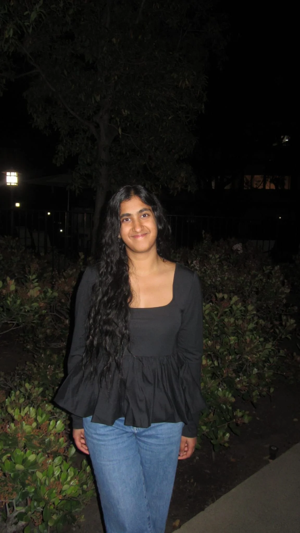 A young woman smiling in the outdoors