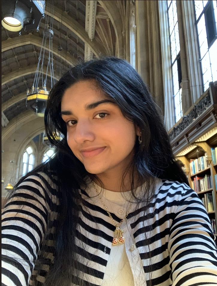 Closeup of a young woman smiling indoors
