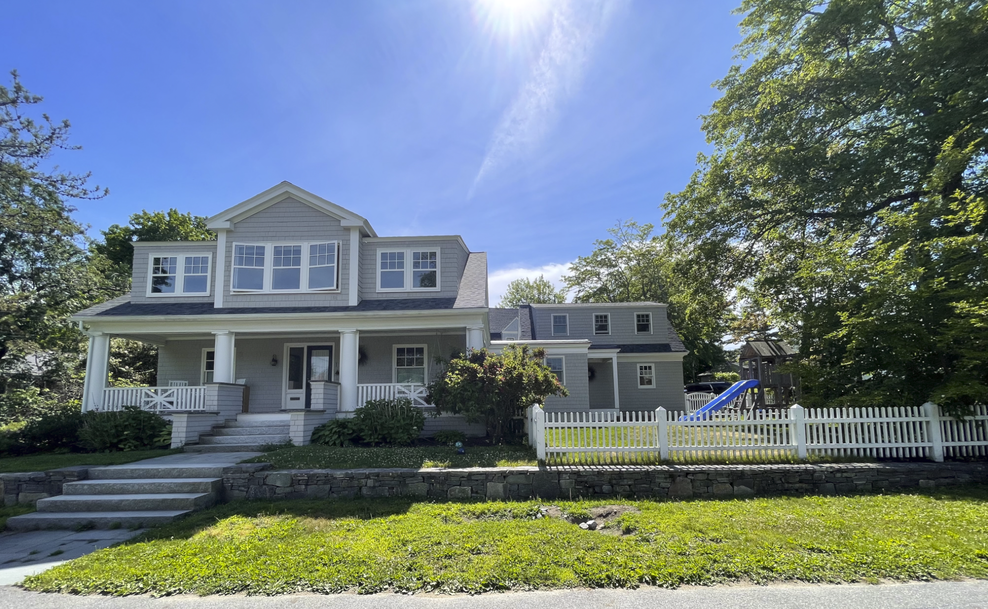 Exterior front facade of 1920s craftsman cottage renovation, Cape Elizabeth, Maine. New Addition