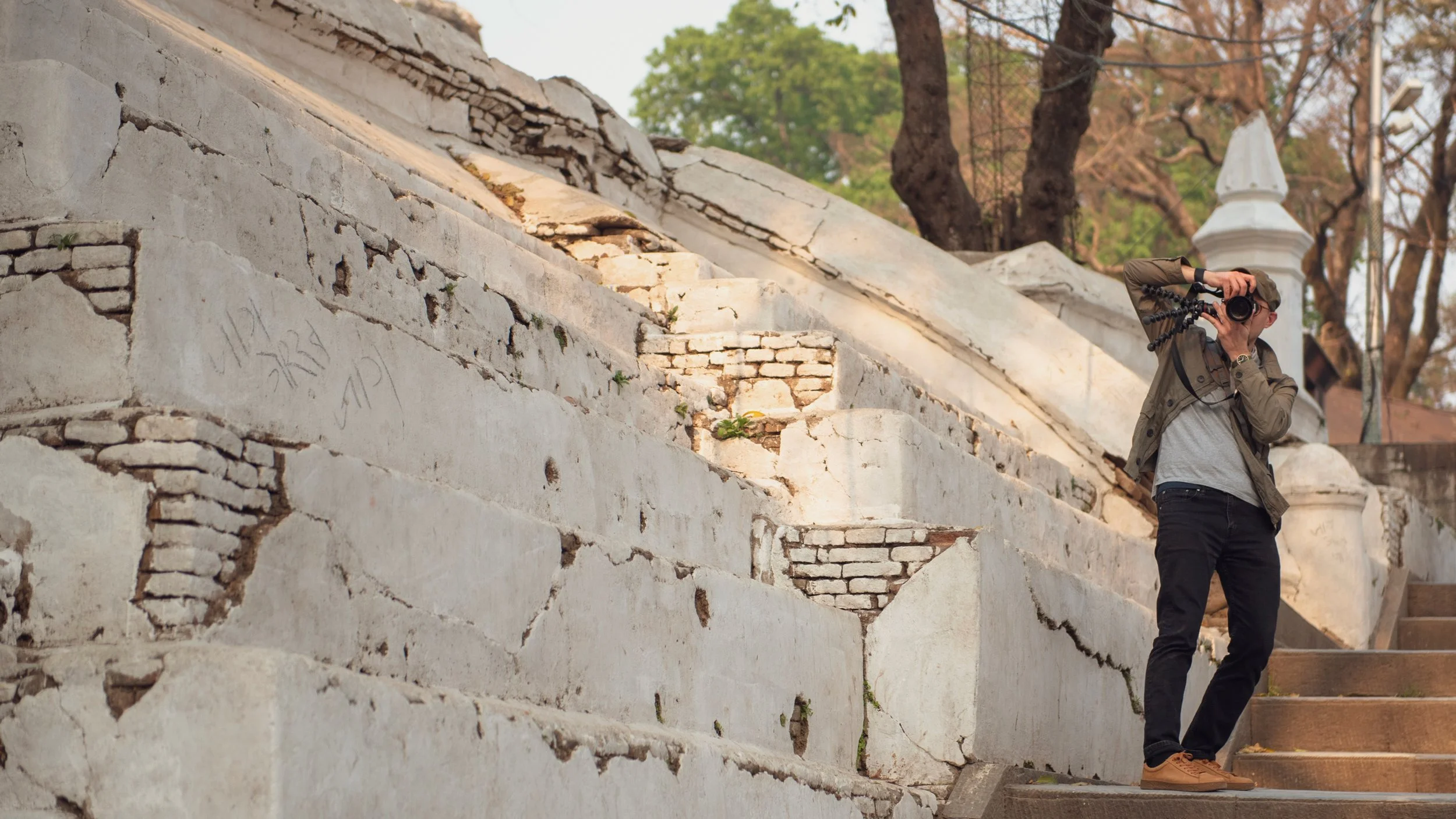 Drew Kora shooting photos at the Pashupatinath Temple cremation complex, Kathmandu Nepal | Photo by Andrew Kommers.