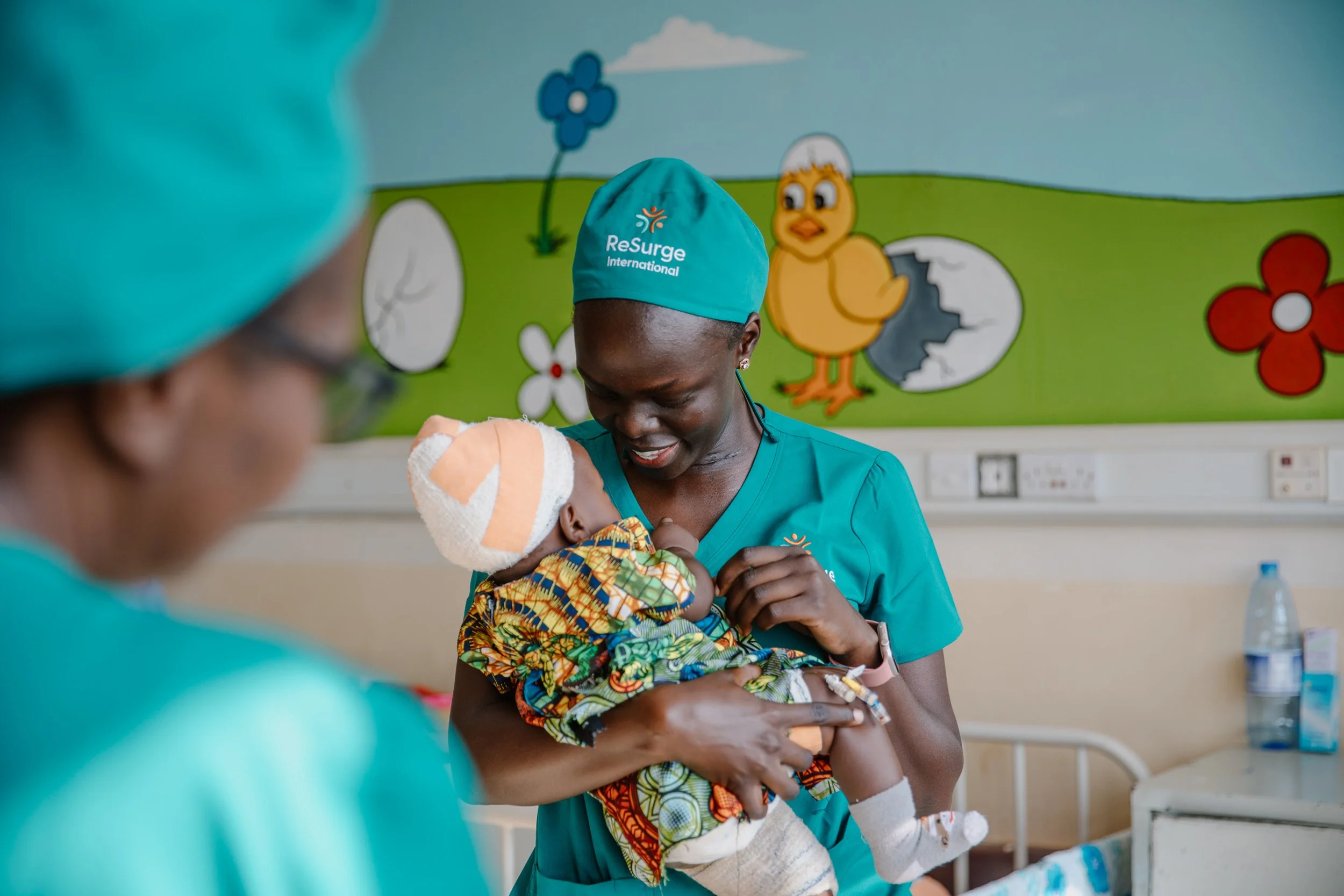 ReSurge-Nurse with baby.jpg