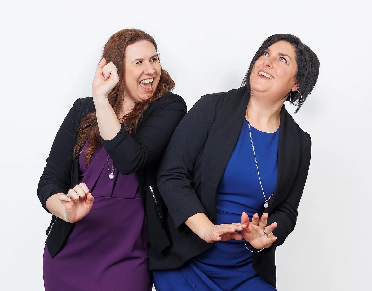 Lindsay Fuchs and Krystal Thorhaug, the Co-Founders of Undercover Creators, smiling and playfully dancing, indicating an approachable and collaborative working relationship.