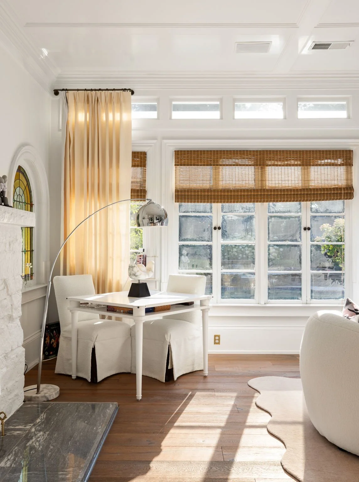 Late afternoon sunlight pours through the pool-facing windows in the living room.