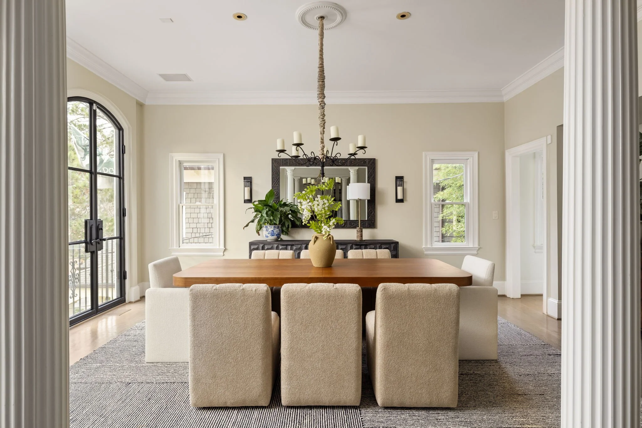 Columns and steel doors frame this bright dining room.