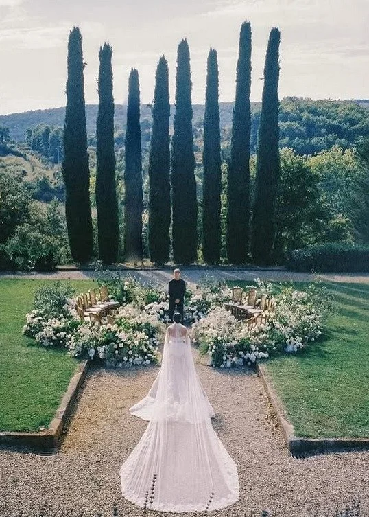 A modern fairytale unfolds in the Tuscan hills &mdash; where romance bloomed beneath cascading florals, dinner was served under glimmering chandeliers, and every detail whispered timeless elegance. From couture gowns to candlelit tablescapes, this ce