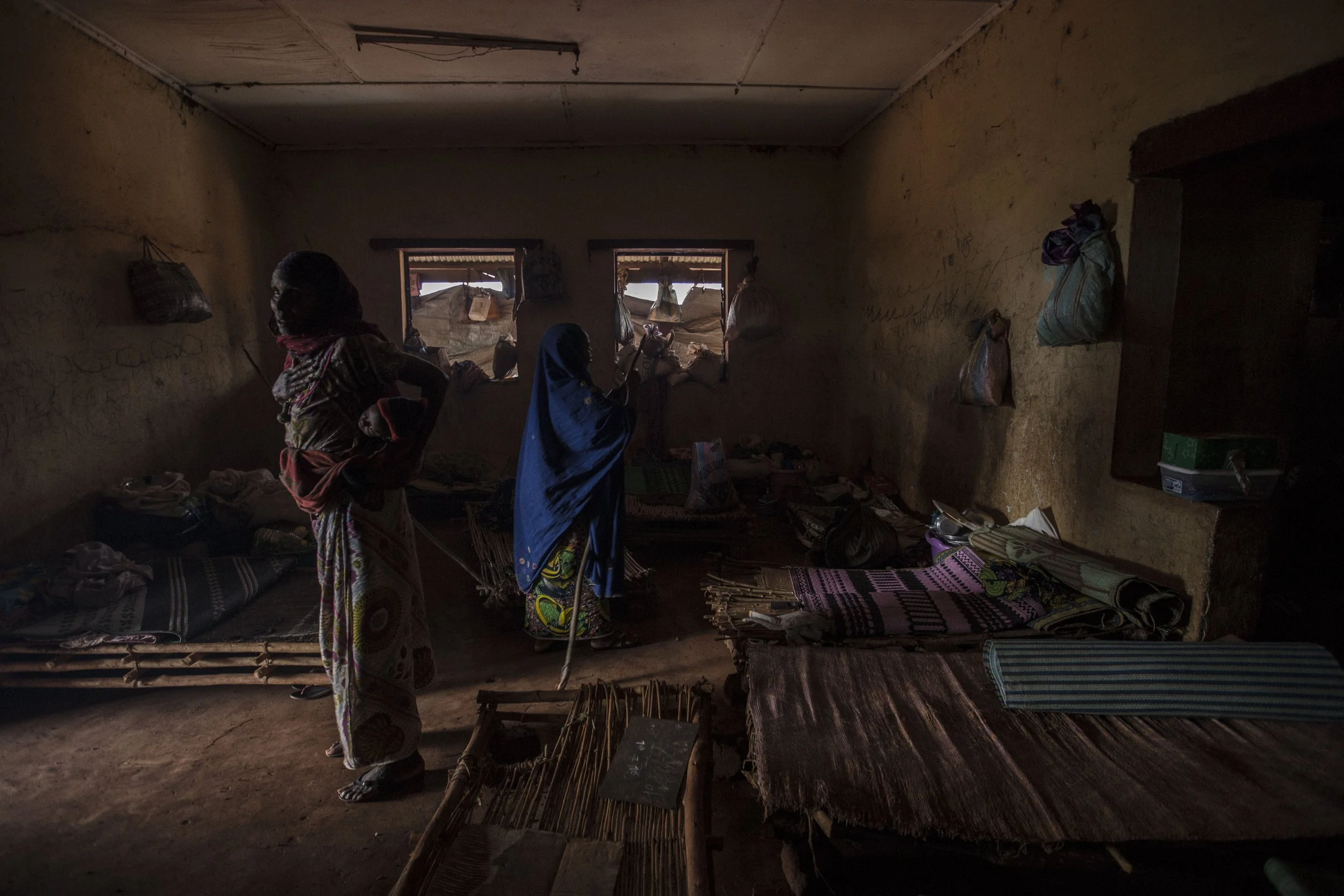 Conflict has forced Peulhs in the western region of the Central African Republic to settlement in spontaneous enclaved sites. Having lived all their lives in open spaces allowing privacy, Peulh women in Yaloke now share rooms at the former local gove
