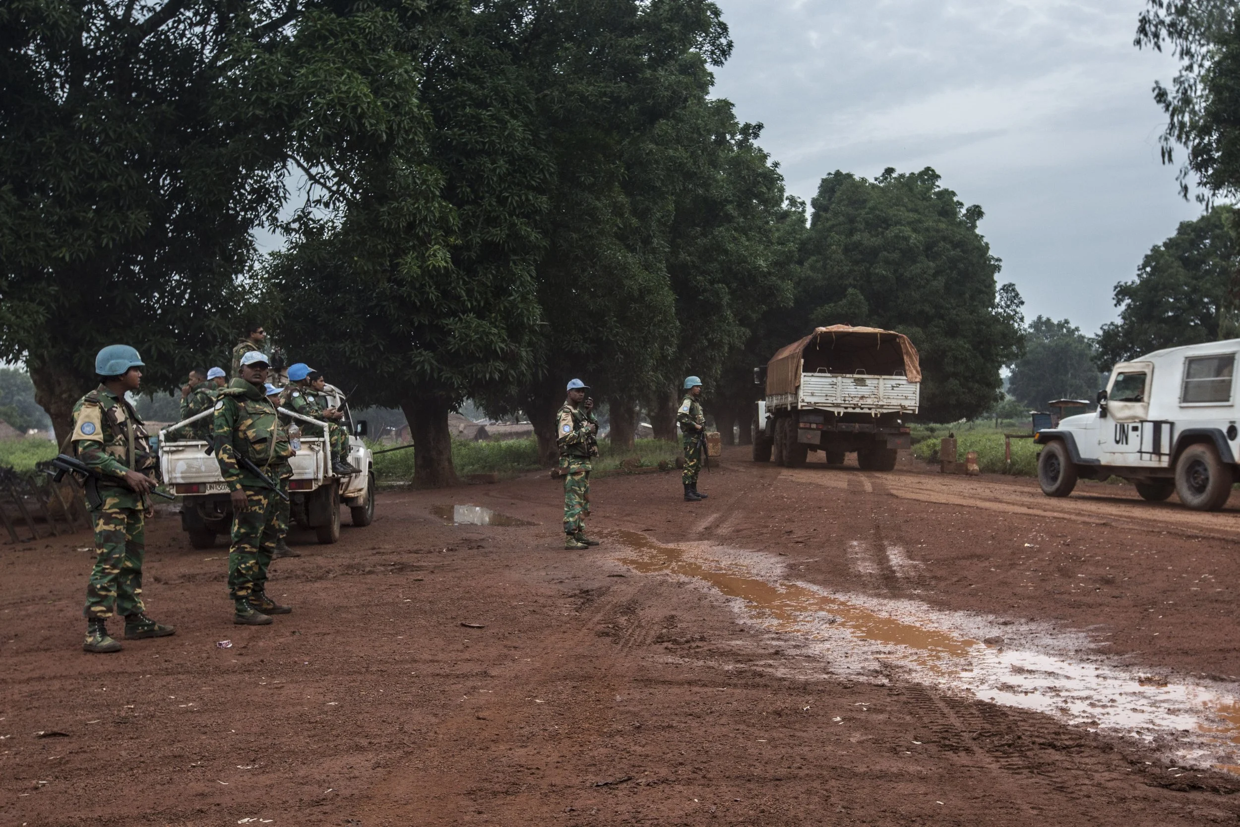 UN blue helmets from Bangladesh supervising traffic activity for convoys on a main national road linking CAR to Cameroon. Moussa's family is still awaiting evacuation across the border.