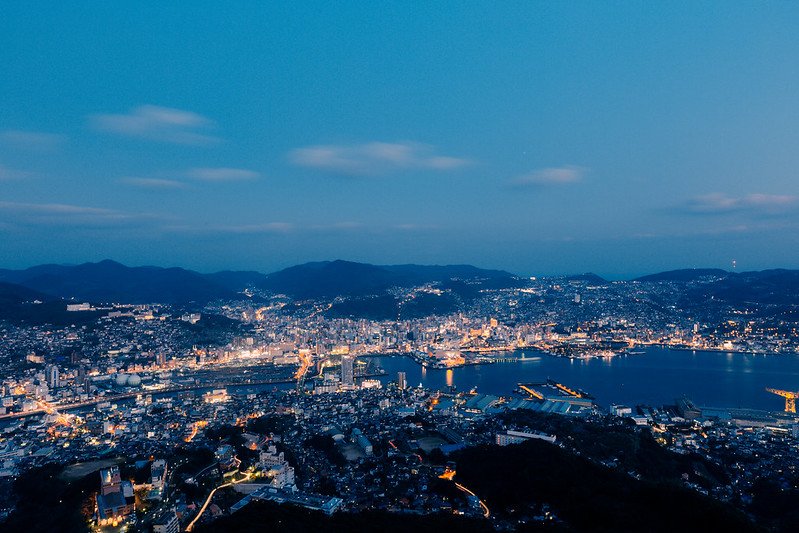 Aerial view of Nagasaki, showcasing its scenic harbor and hills.