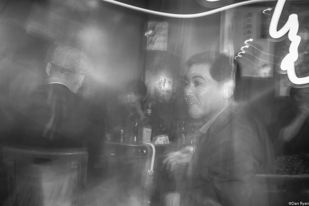 a mafia figure, dressed in a sharp suit