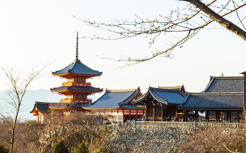 Kiyomizu Pagoda with its vibrant red structure set against the backdrop of Kyoto's scenic landscape.