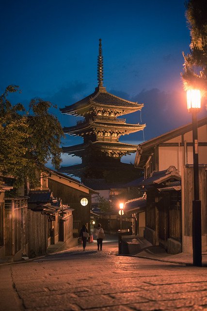 Yasaka Pagoda in Kyoto, a historic wooden structure with five tiers, set against a clear sky.