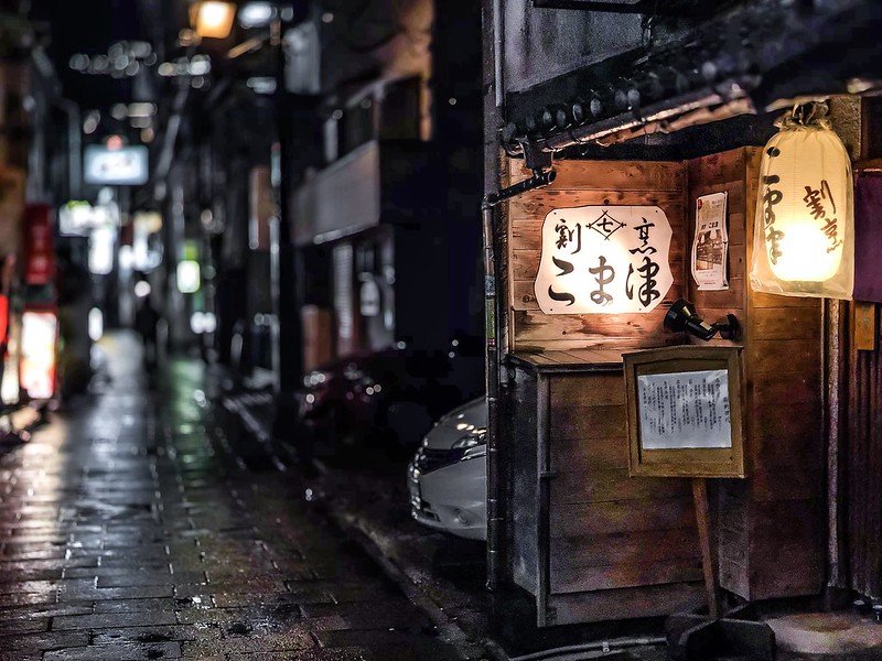 Narrow alley in Nagasaki, filled with history and local charm.