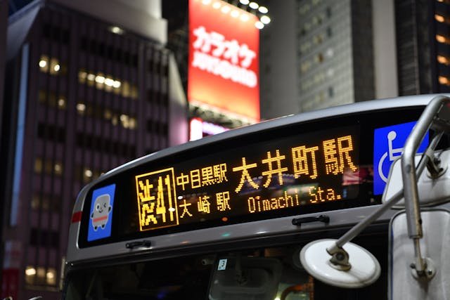 A modern digital sign displayed on a car, showcasing vibrant graphics and advanced technology for dynamic messaging.
