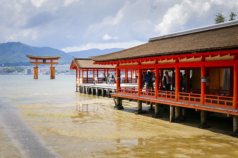 Miyajima Shrine with its iconic torii gate floating in the sea.