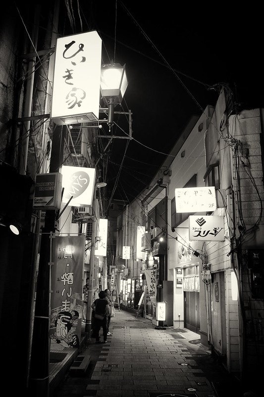 Local street in Nagasaki, lined with traditional shops and vibrant culture.