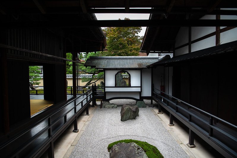 A beautiful garden at Ginkakuji, featuring a carefully manicured landscape with paths, ponds, and seasonal plants, embodying the principles of Japanese aesthetics and Zen philosophy.