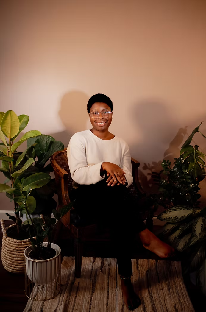 Robi Hamilton in her peaceful treatment room, providing personalized therapeutic massage plans.