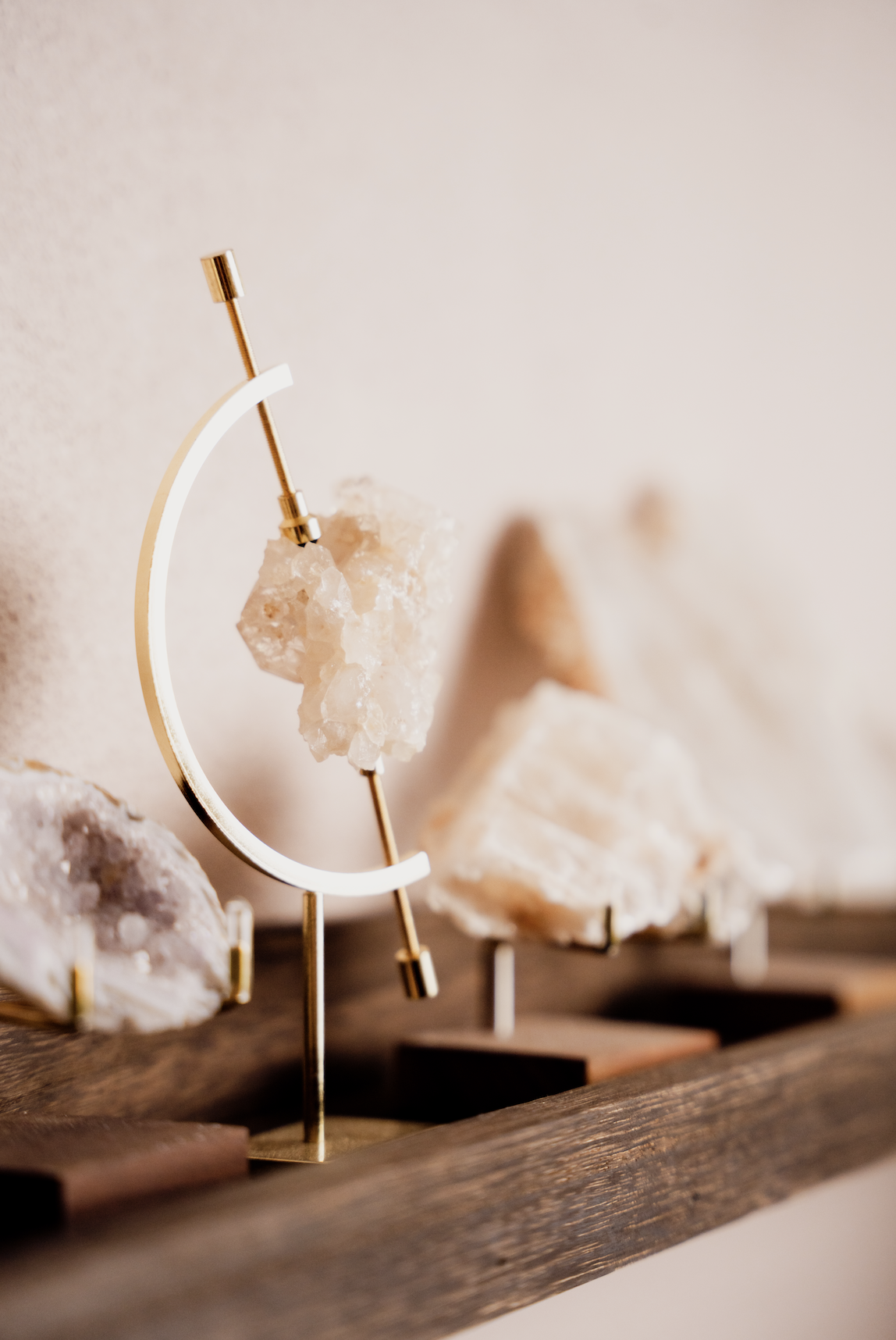 Intentional healing decor and crystals that create a restorative atmosphere in the Bliss Studio sanctuary.