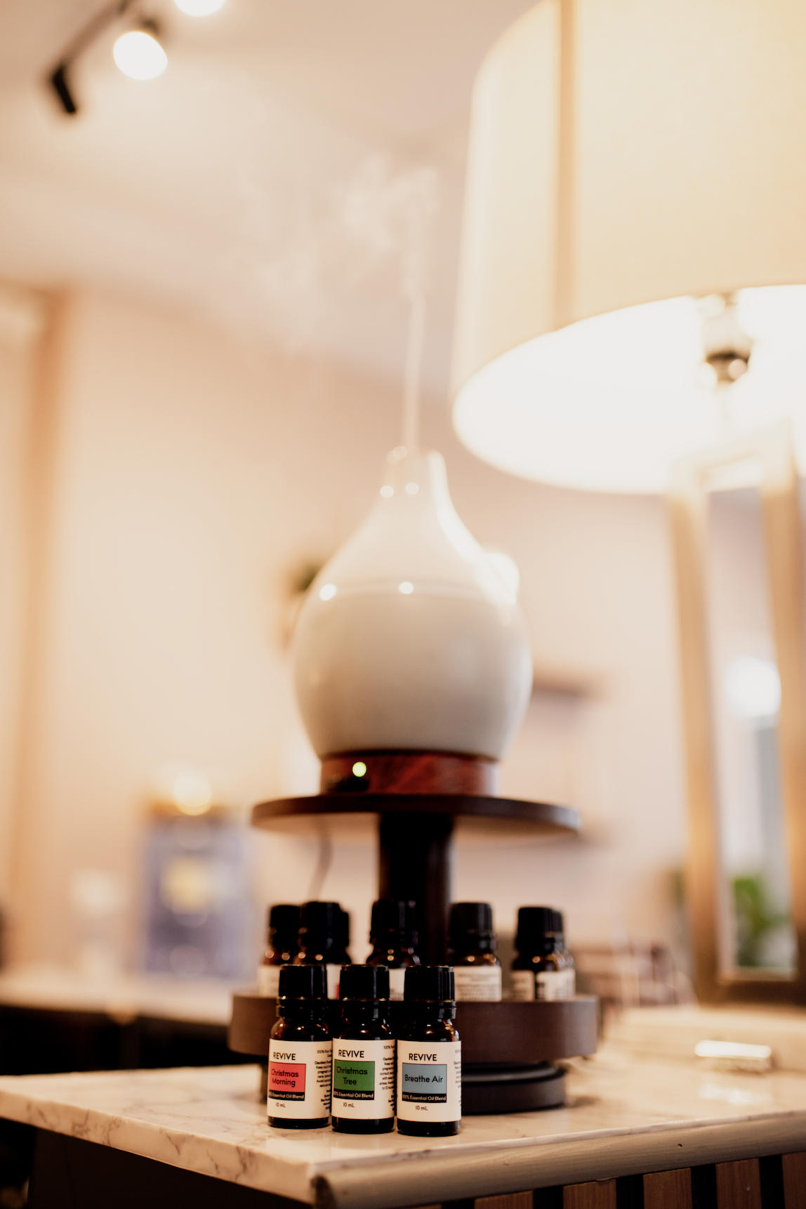 A close-up of essential oils and calming candles used during therapeutic sessions at the studio.