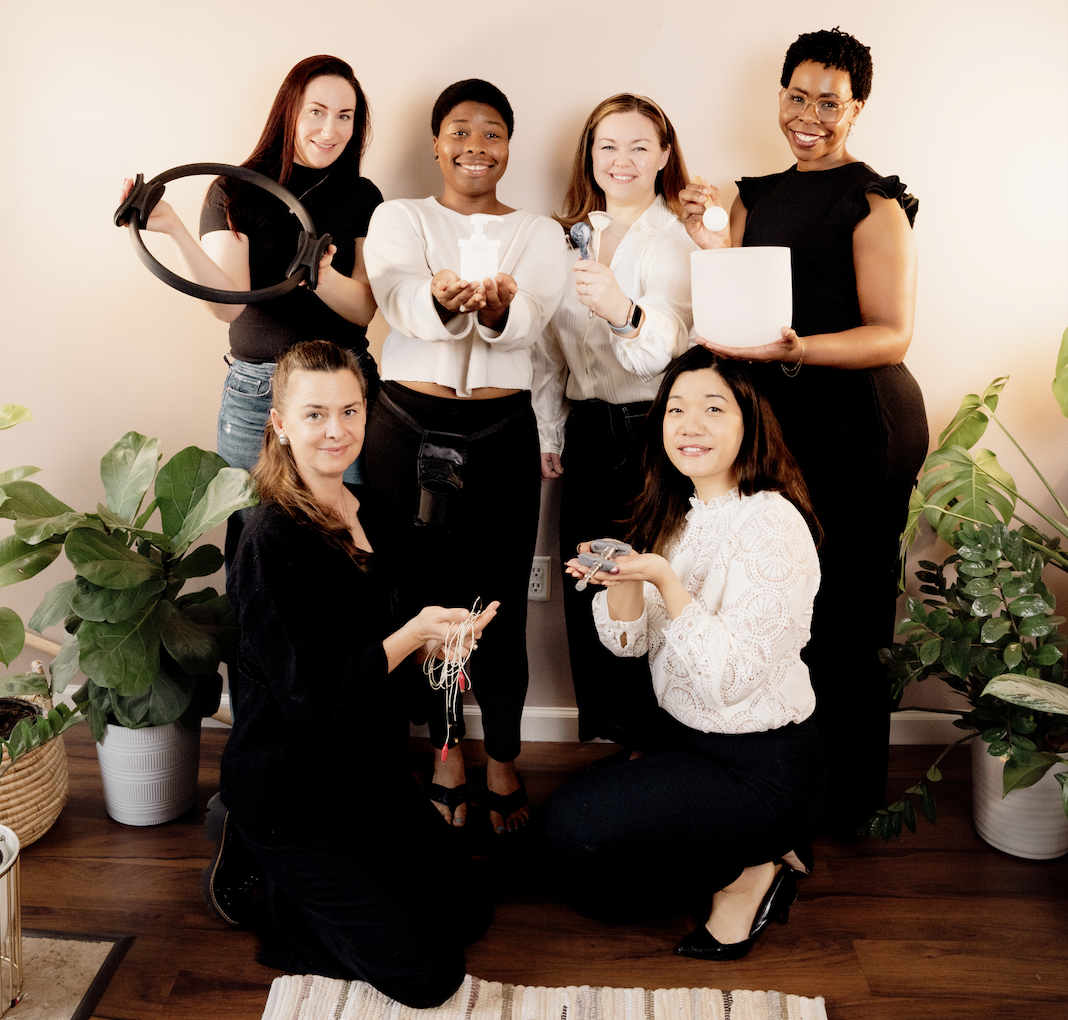 A candid photo of the Bliss Studio collective, highlighting the supportive and collaborative community of health experts.