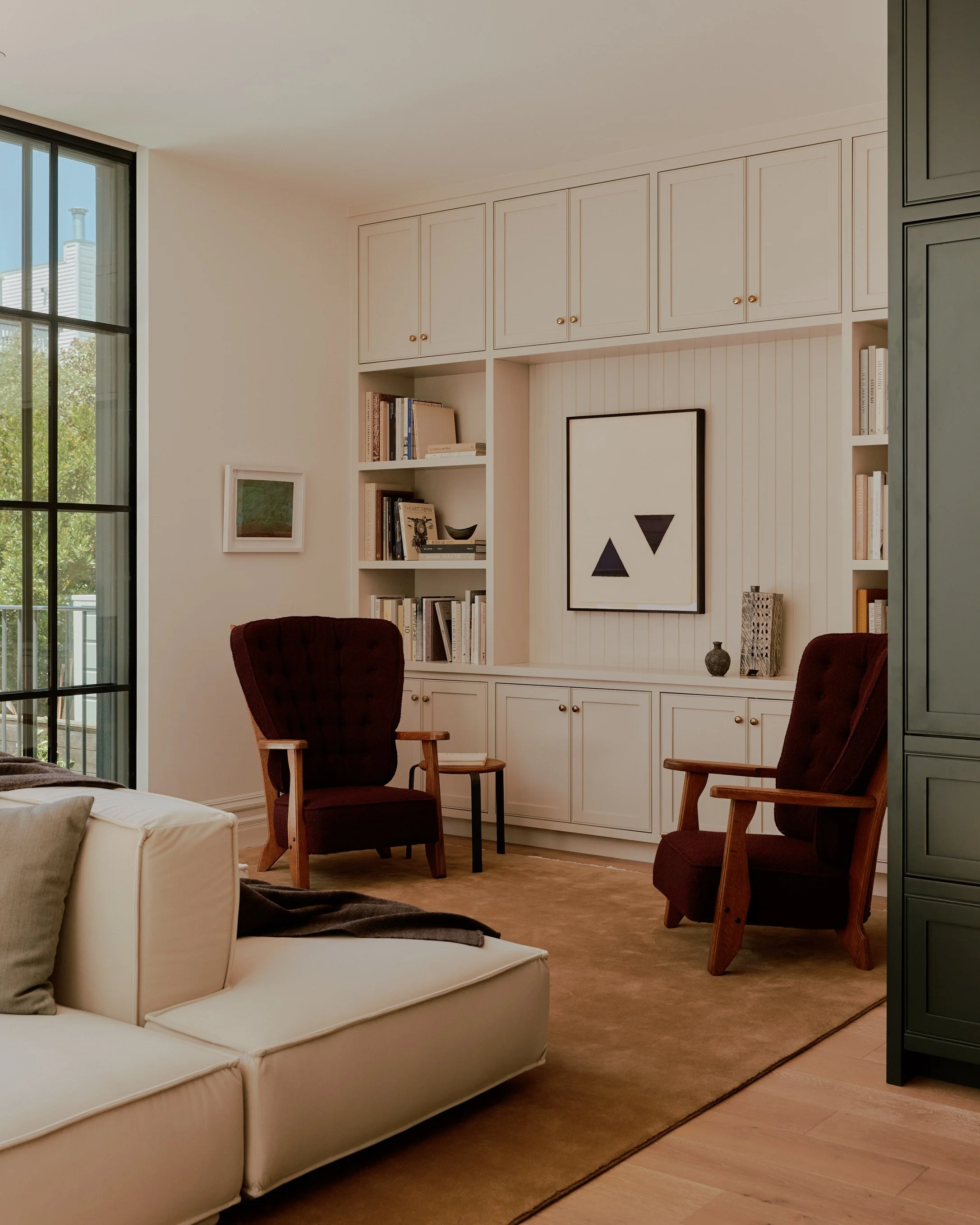 Seating area and book case.