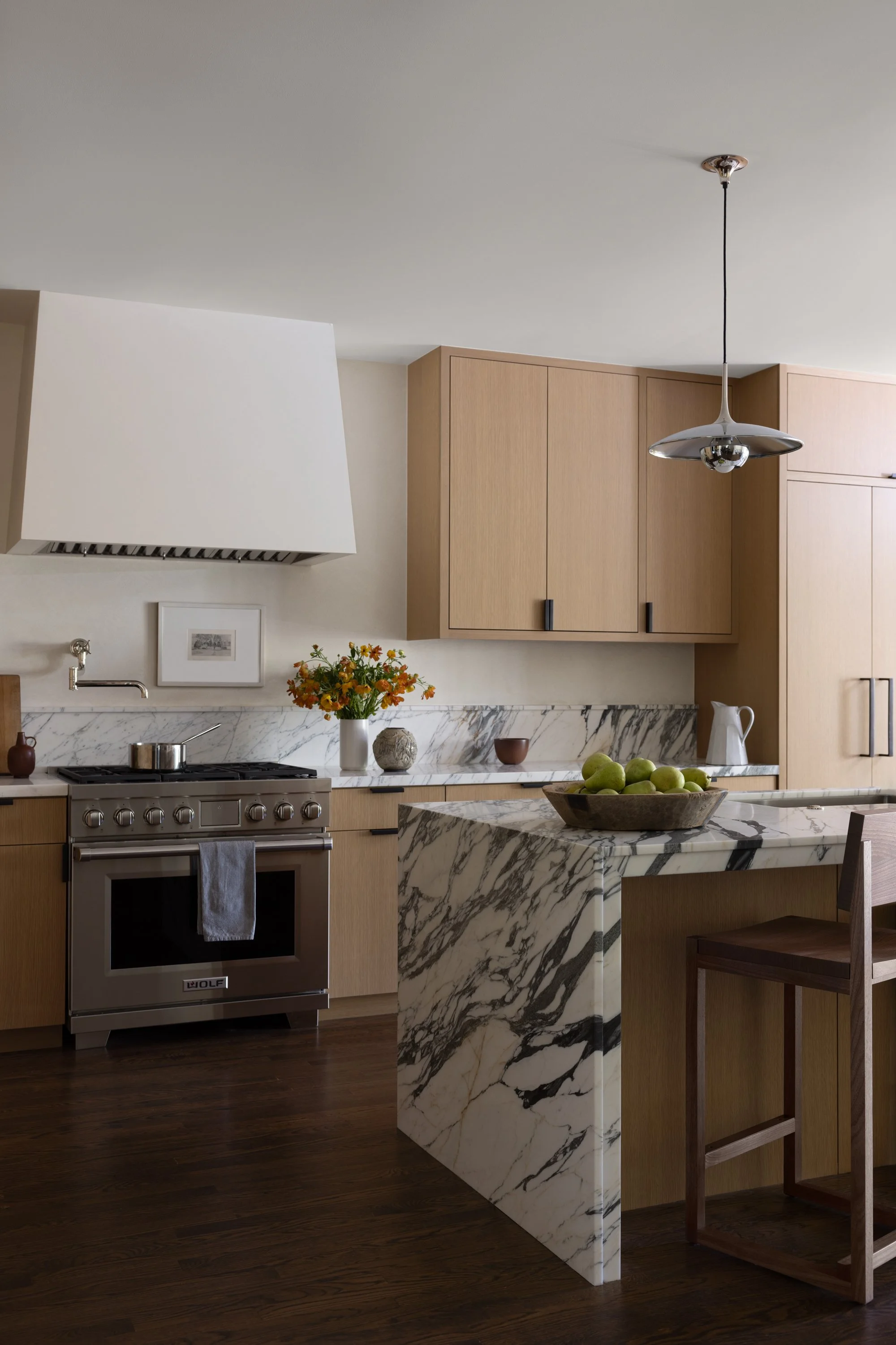 Side view of the kitchen with range and kitchen island visible.
