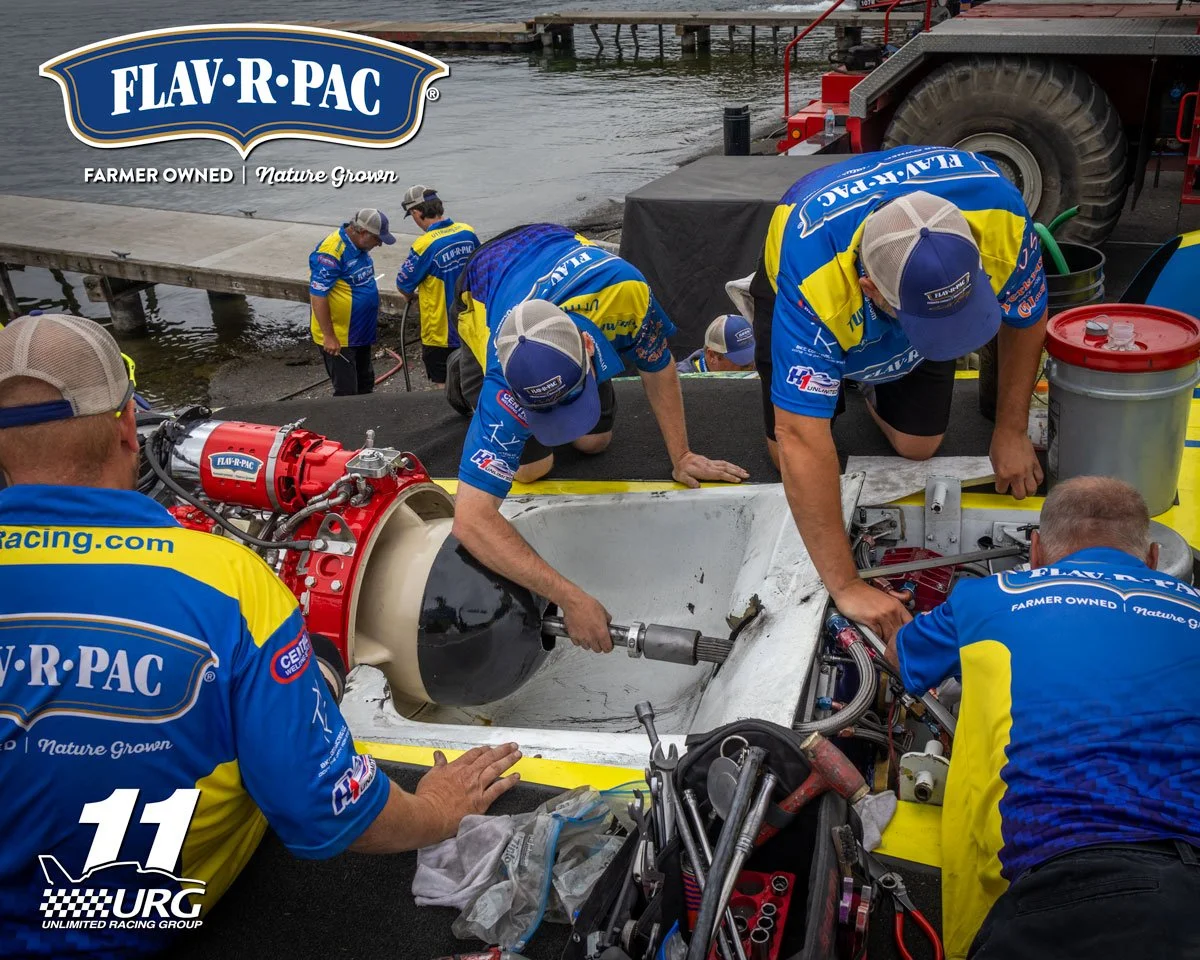 U-11 Miss FLAV-R-PAC crew members Travis Johnson, Colin Rudnick, Ken Knudsen Jr., and Ken Knudsen working on the boat before heat racing. Before every run, every system is gone over and problems fixed to get the most out of the race boat on every run