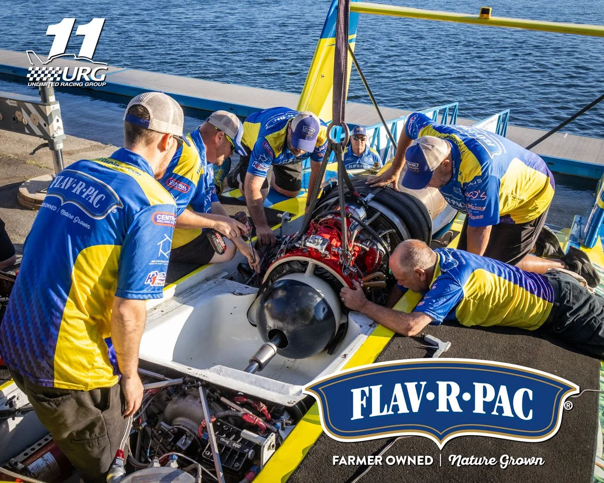 The U-11 Miss FLAV-R-PAC crew installing the T-55 turbine. From L-R, Colin Rudnick checking shaft alignment, Travis Johnson tightening motor mount, Brian Benke making sure shims don't move, Randy Roe waiting to put short shaft with prop on, Ken Knuds