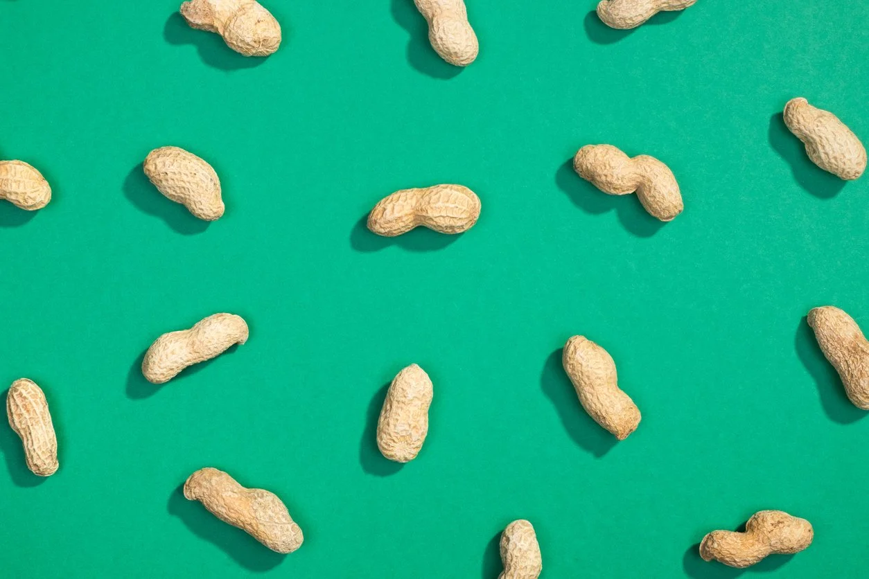 peanuts in shell green background