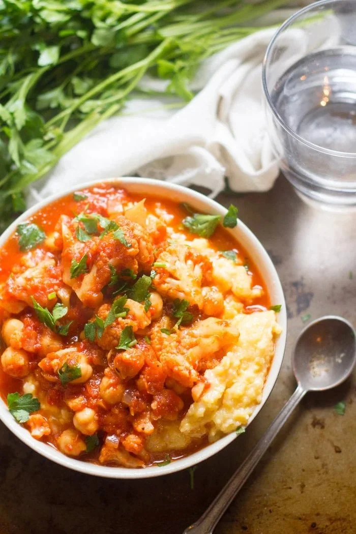 CAULIFLOWER &amp; CHICKPEA CREAMY POLENTA BOWLS WITH ROASTED RED PEPPER TOMATO SAUCE