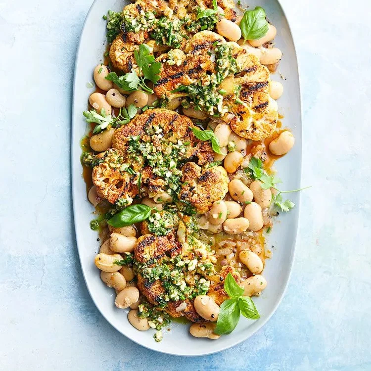 GRILLED CAULIFLOWER STEAKS WITH ALMOND PESTO BUTTER BEANS