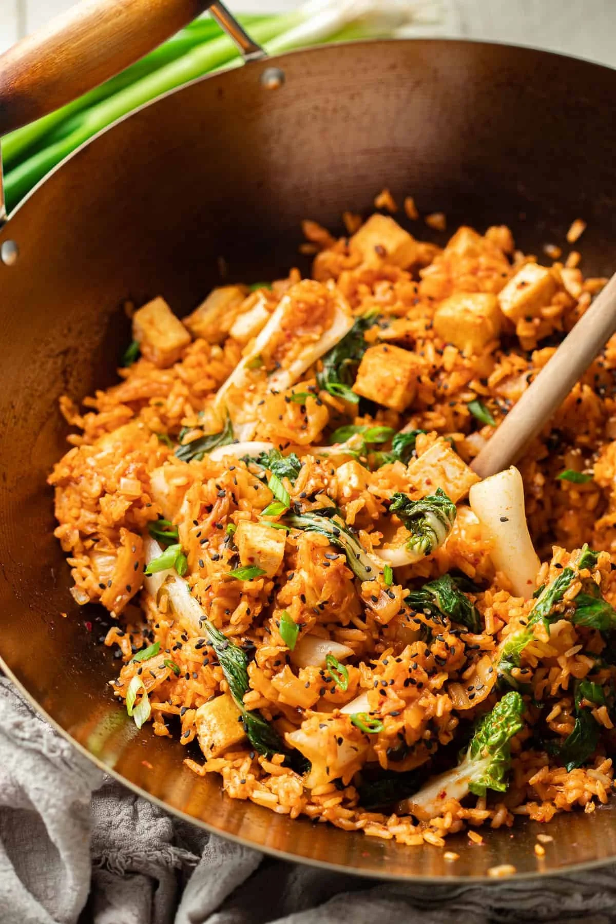vegan kimchi fried rice with onions and tofu