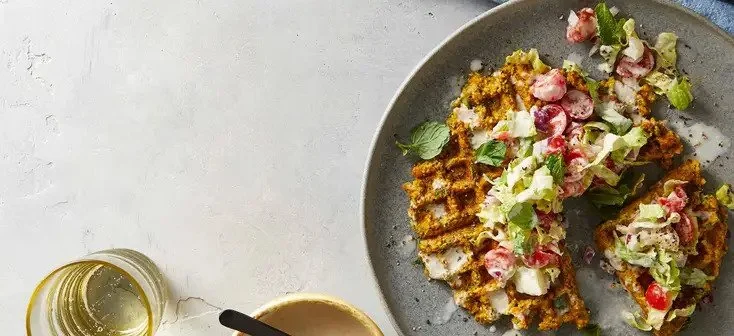FALAFEL WAFFLES WITH TOMATO SALAD AND TAHINI SAUCE