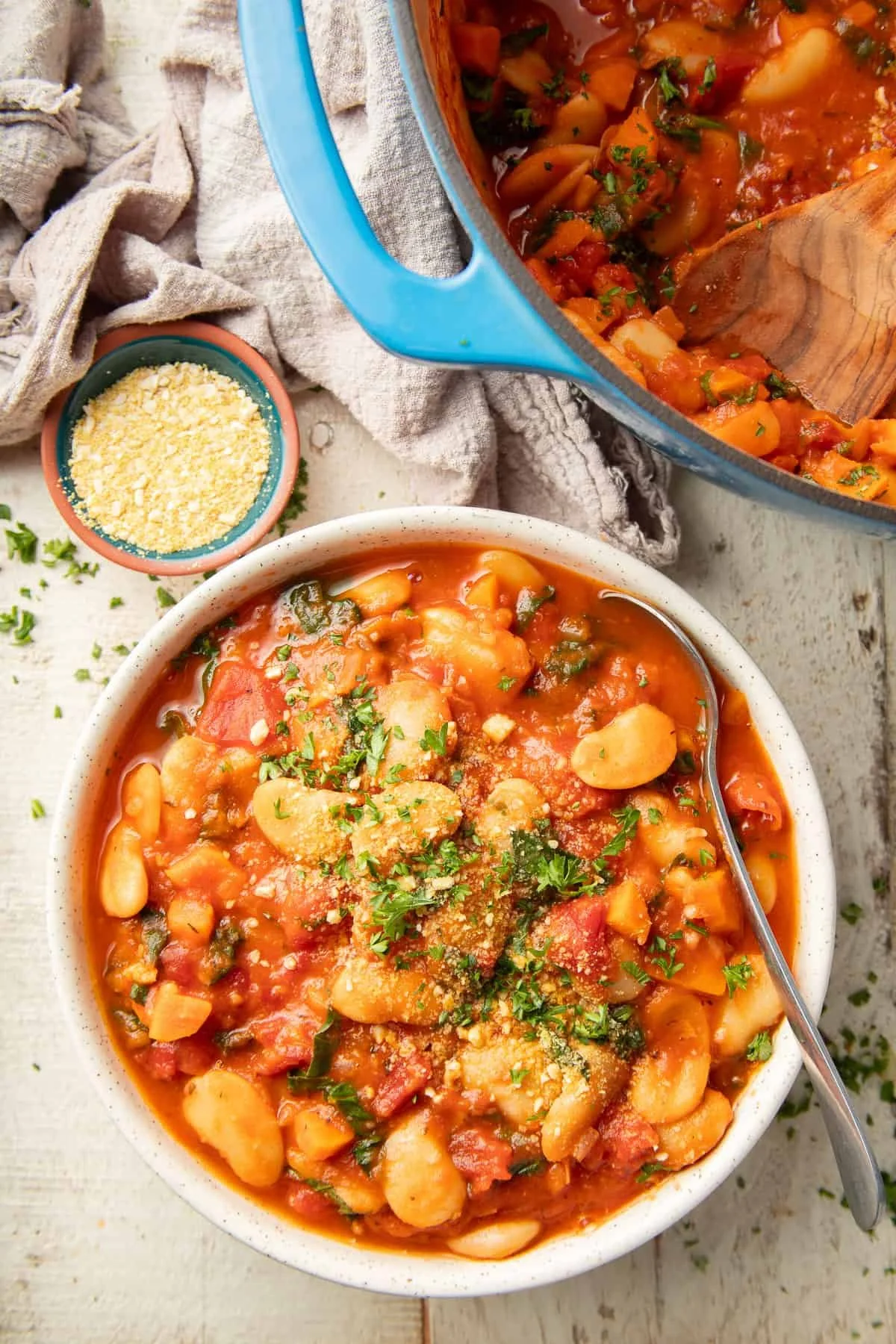 bowl of Italian butter bean stew topped with vegan parmesan