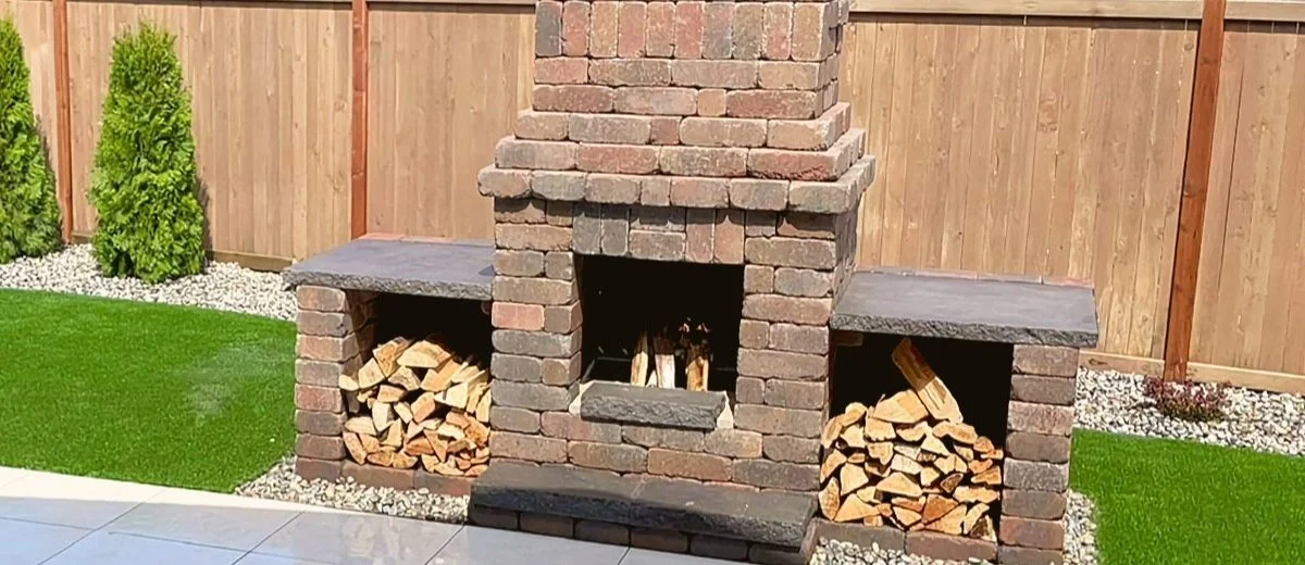 Western Interlock outdoor woodburning fireplace with two wood storage units
