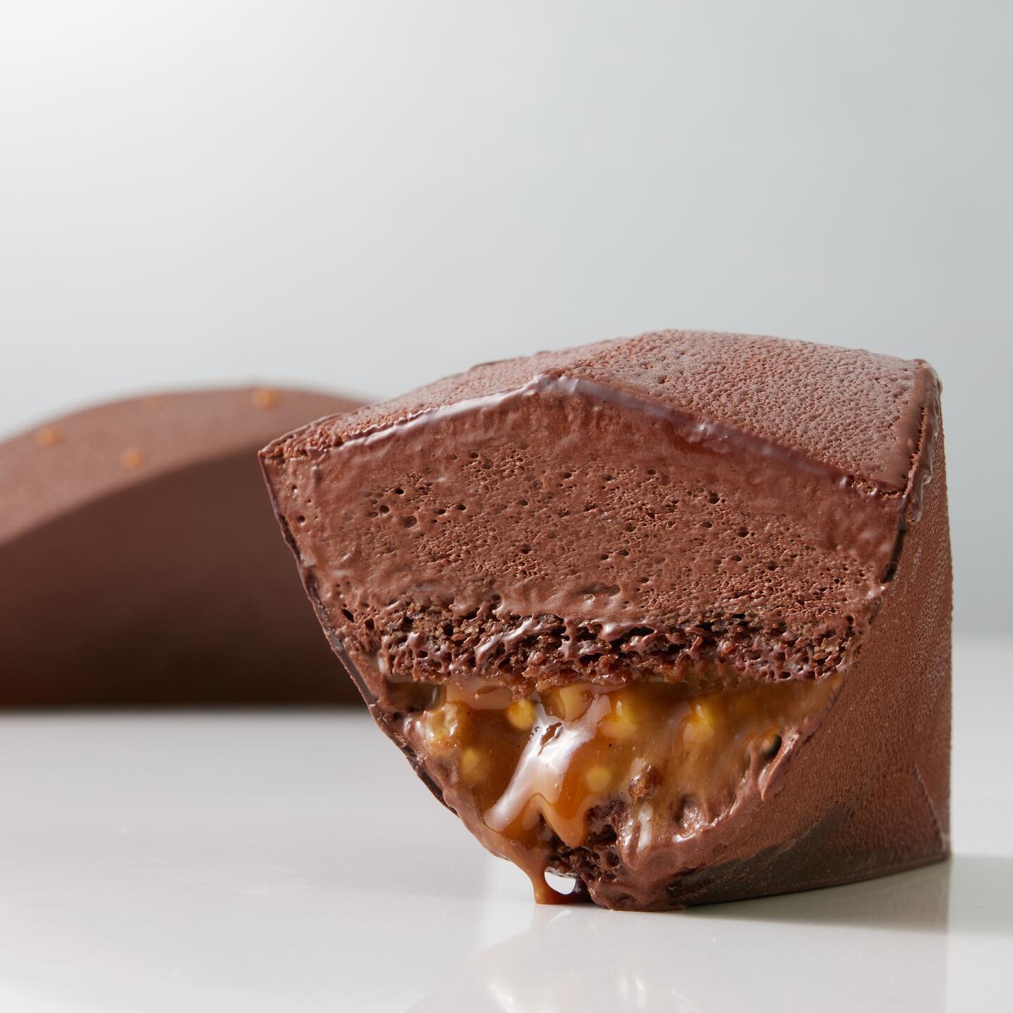 The mold for this entremet is created from recycled paper, with a thin layer of tempered chocolate to create a moisture-proof barrier. My goal is to inspire chefs to think beyond plastic and silicon, and consider the range of sustainable materials th