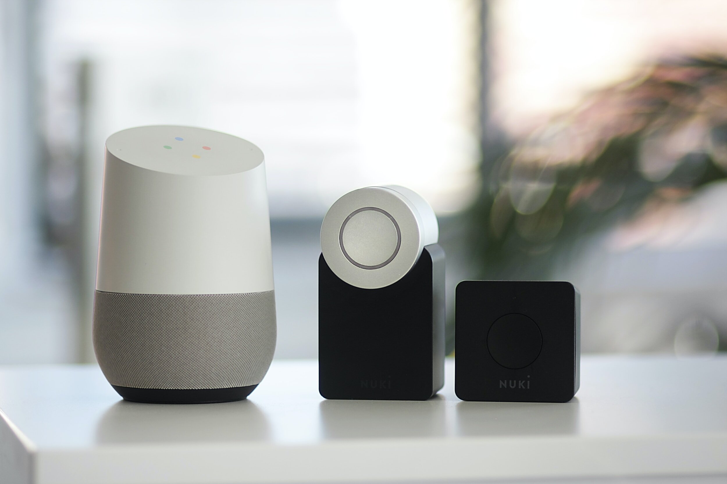 Smart speaker and smart lock devices on a table