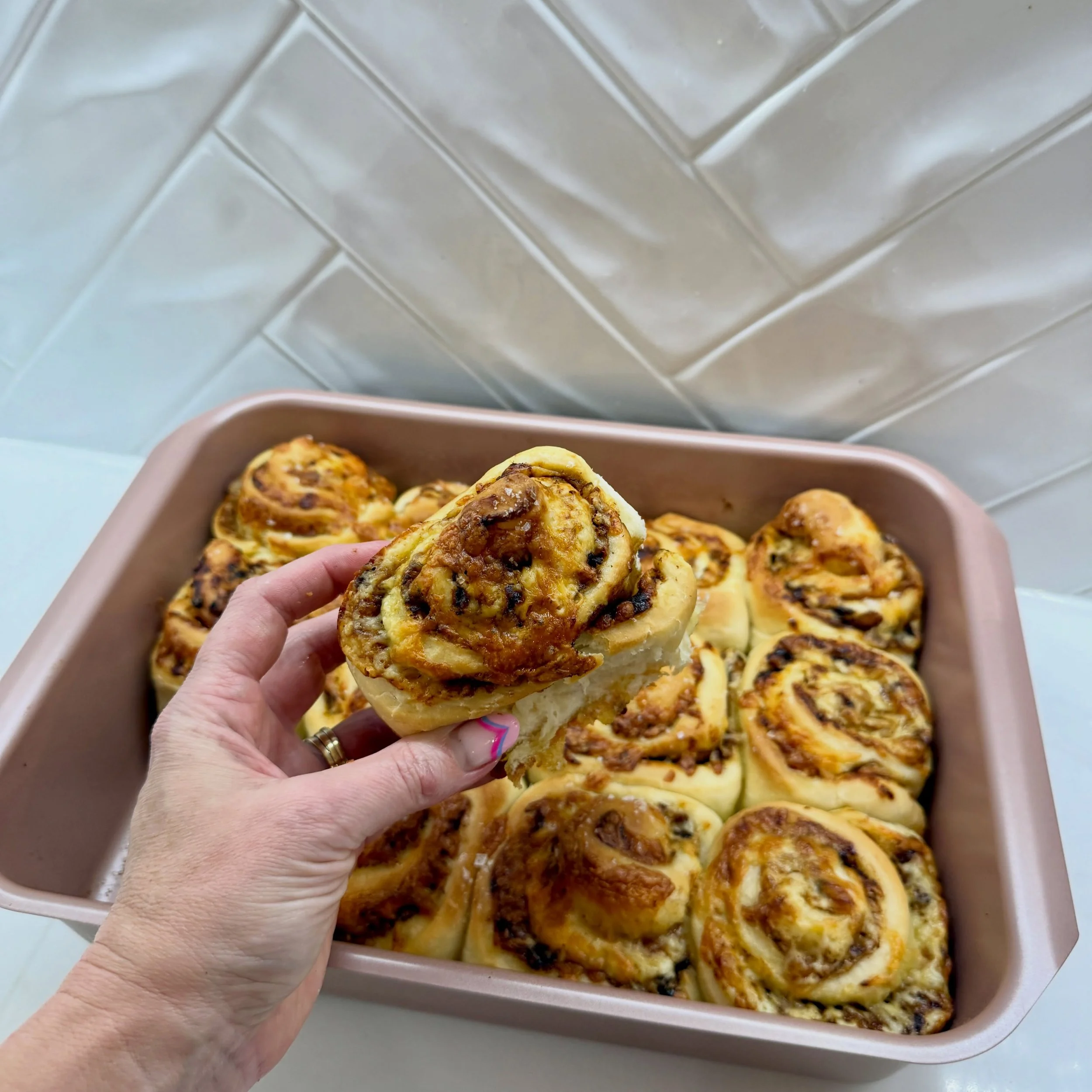 CHEESYMITE SCROLLS 🧀

These cheesymite scrolls are hands down my boys&rsquo; favourite savoury lunchbox filler!
Just whip up the dough, roll it out, spread with butter and Vegemite, sprinkle generously with cheese, then roll, slice, and bake for 20 